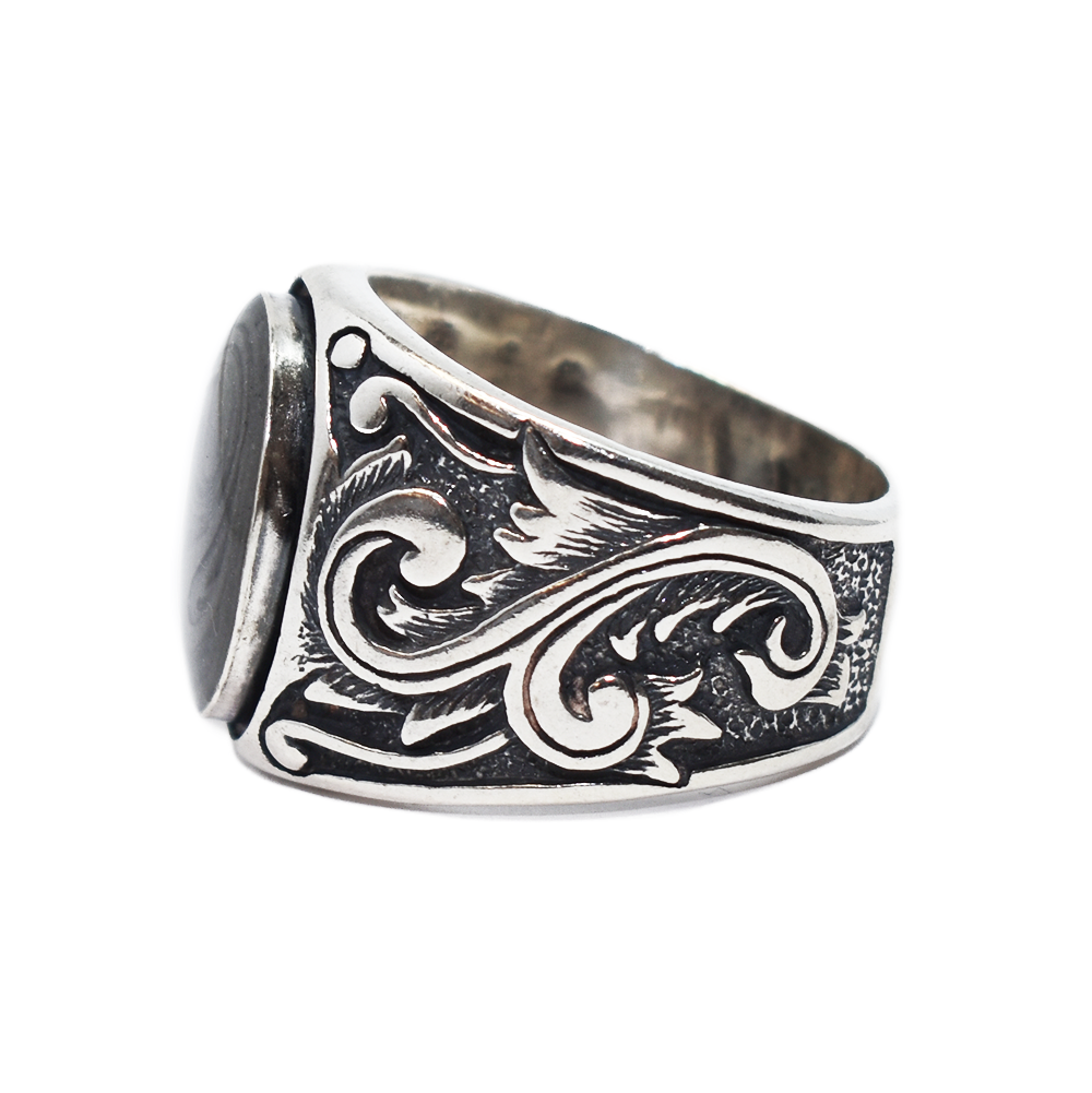Pictured here is the close by me jewelry's Floral Art Deco Band Cremation Ring in Sterling Silver from the side to show the detailing of the filigree along the band