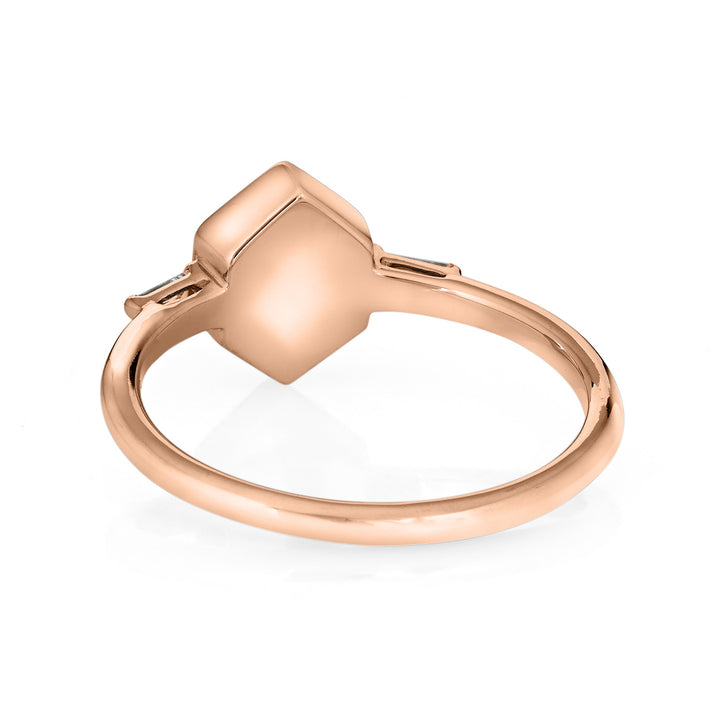 Pictured here is close by me jewelry's 14K Rose Gold Hexagon Ashes Ring with White Baguette Diamonds from the back to show the back of the setting and band detail