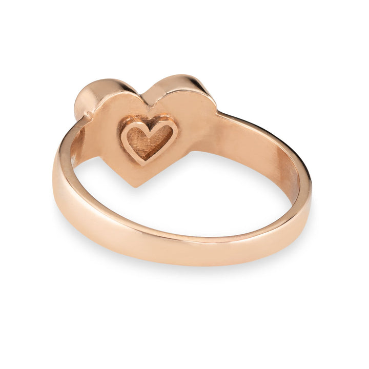 Pictured here is the Imprint Heart Ring in 14K Rose Gold by close by me jewelry from the back to show the wide band and heart outline on the back of the bezel