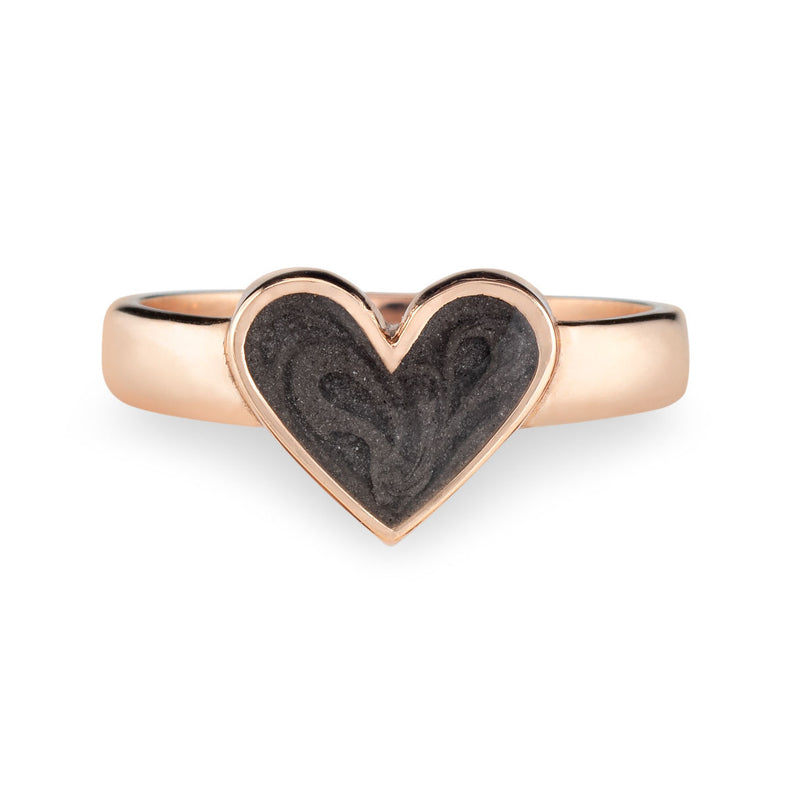 Pictured here is the Imprint Heart Ring in 14K Rose Gold by close by me jewelry from the front to show its dark grey cremation setting