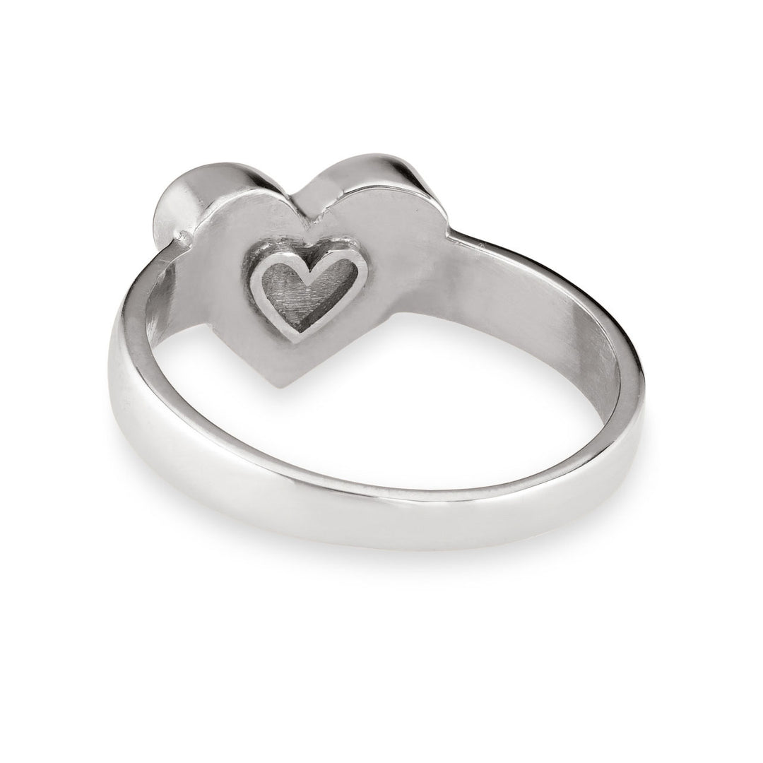 Pictured here is close by me jewelry's Imprint Heart Cremation Ring design in Sterling Silver from the back to show its wide band and heart outline on the back of the bezel