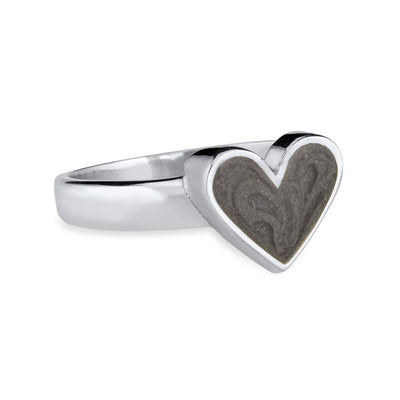 Pictured here is the Imprint Heart Ring in 14K White Gold by close by me jewelry from the side to show its dark gray ashes setting and thickness of the bezel