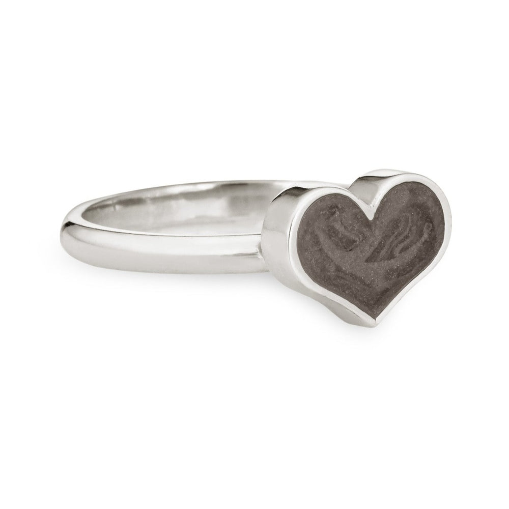 Pictured here is close by me jewelry's Sterling Silver Large Heart Stacking Cremation Ring from the side, showing a dark gray setting