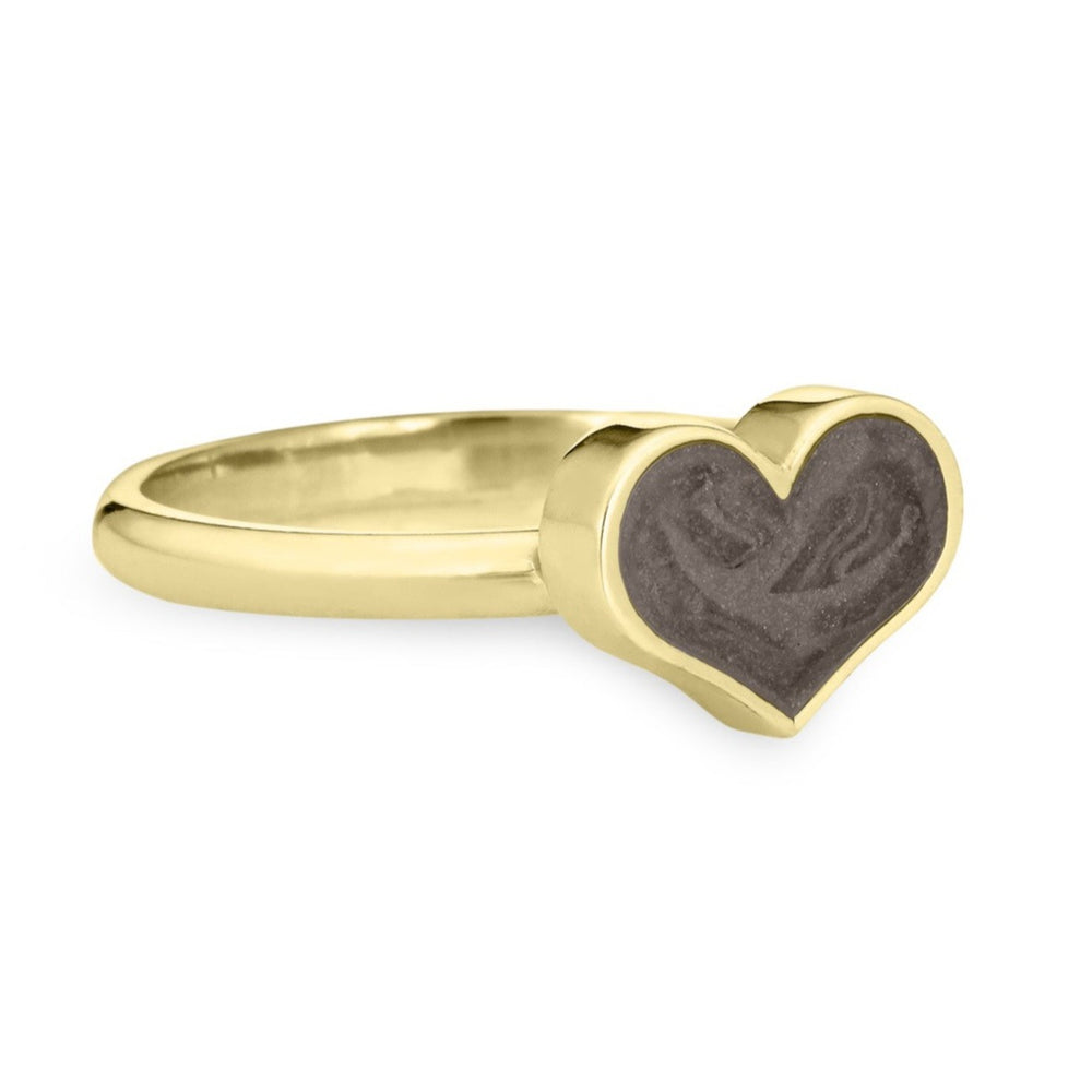 Pictured here is close by me jewelry's Large Heart Stacking Cremation Ring design in 14K Yellow Gold from the side with a dark gray ashes setting