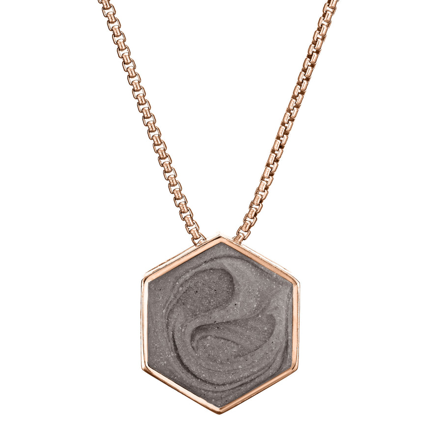 Pictured here is a front view of close by me's Large Hexagon Sliding Pendant in 14K Rose Gold