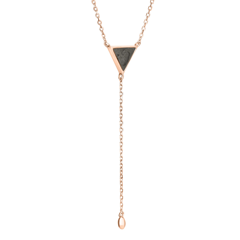Pictured here is the Lariat Cremation Necklace design in 14K Rose Gold by close by me jewelry from the side to show its dark gray ashes setting and thickness of its bezel