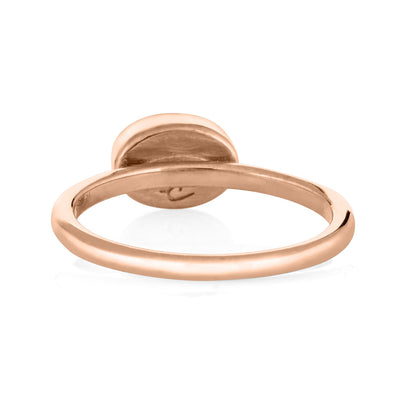 This photo shows close by me jewelry's 14K Rose Gold Lateral Oval Stacking Cremation Ring design from the back