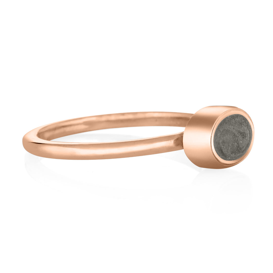 This photo shows close by me jewelry's 14K Rose Gold Lateral Oval Stacking Cremation Ring design from the side