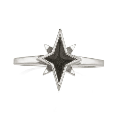 Pictured here is close by me jewelry's Sterling Silver North Star Cremation Ring from the front to show its dark gray ashes setting