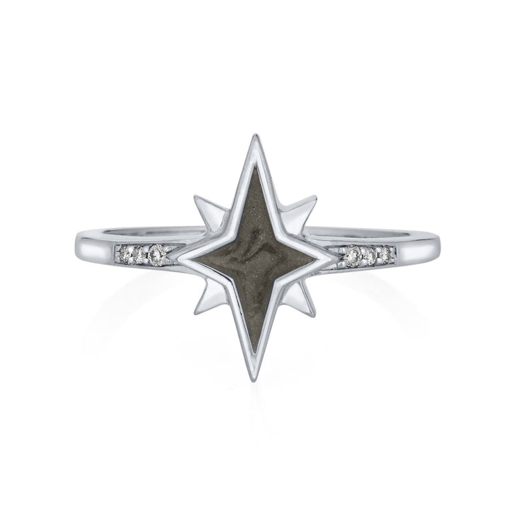 Pictured here is close by me jewelry's 14K White Gold and White Diamond North Star Ashes Ring from the front to show its medium gray setting and three circular diamonds in its band