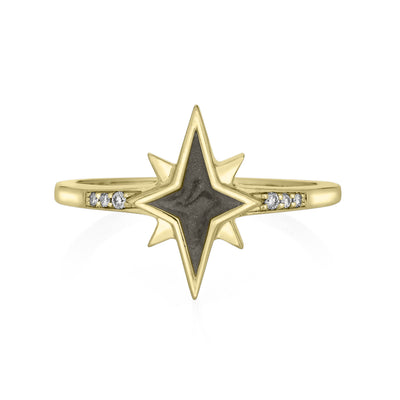 Pictured here is the 14K Yellow Gold North Star Diamond Band Ashes Ring design by close by me jewelry from the front to show its medium gray cremation setting and three circular diamonds in the band