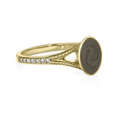 Pictured here is close by me jewelry's 14K Yellow Gold Oval Split Shank Champagne Diamond Band Ashes Ring from the side, showing its medium gray setting and milgrain and diamond detailing on the band