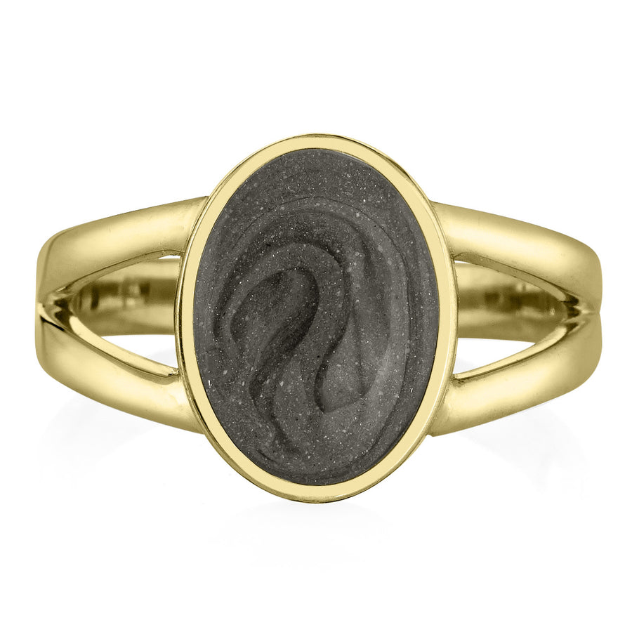 Pictured here is close by me jewelry's 14K Yellow Gold Oval Split Shank Ashes Ring design from the front to show its medium grey cremation setting and split band