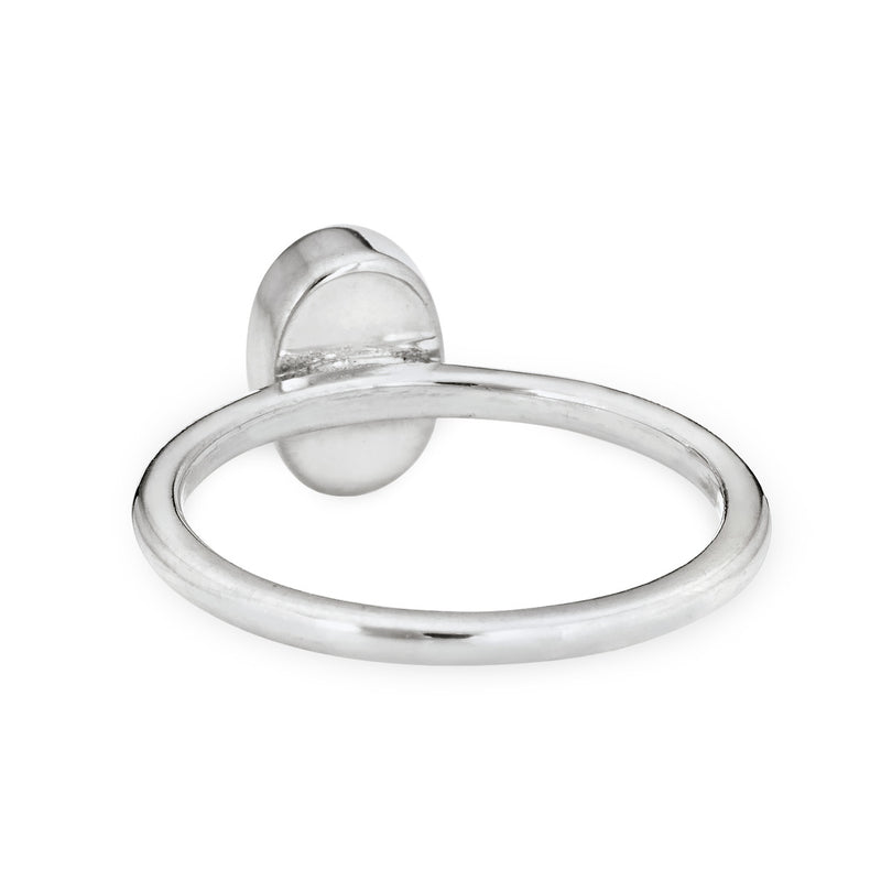 This photo shows the 14K White Gold Oval Stacking Ashes Ring designed by close by me jewelry from the side