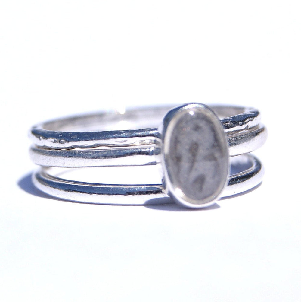 Pictured here is the Sterling Silver Oval Stacking Ring Set with ashes designed by close by me jewelry from the front at a slight angle to the right