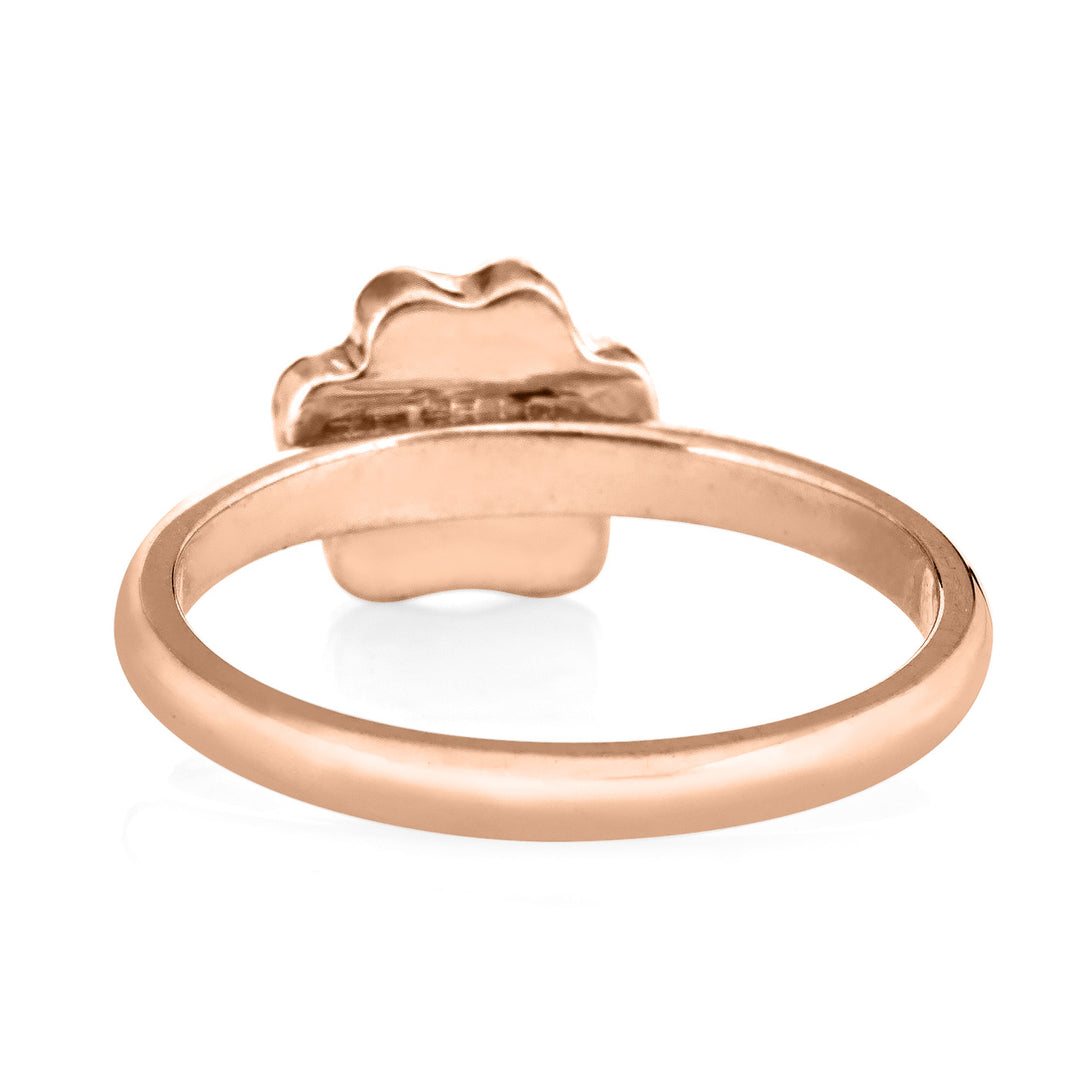 Pictured here is the 14K Rose Gold Paw Print Stacking Cremation Ring design by close by me jewelry from the back to show the back of the setting and inside of the band