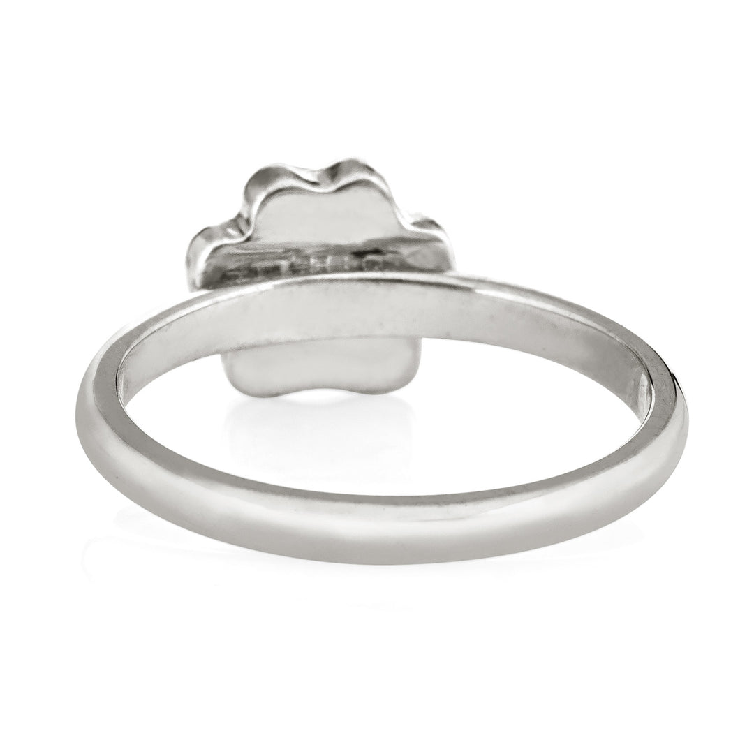 Pictured here is the Paw Print Stacking Cremation Ring in Sterling Silver by close by me jewelry from the back to show the inside of the band and back of the setting