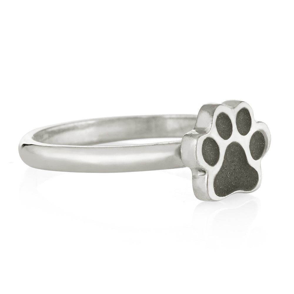 Pictured here is the Paw Print Stacking Cremation Ring in Sterling Silver by close by me jewelry from the side to show how the band connects to the setting