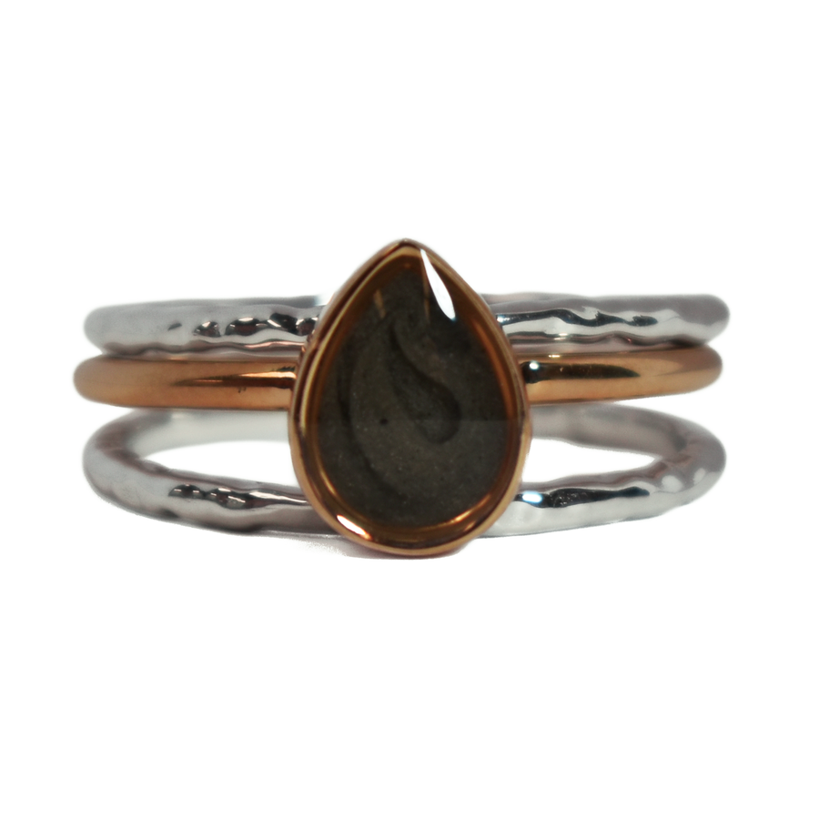 This photo shows the Pear Cremation Stacking Ring in 14K Rose Gold paired with two 14K White Gold Textured Companions to create one of close by me jewelry's ashes stacking ring sets from the front