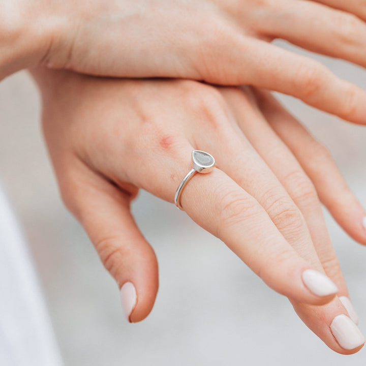 This photo shows the Sterling Silver Pear Stacking Ring design on a model's hand