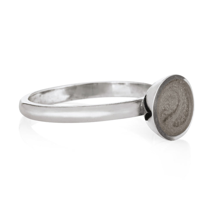 This photo shows close by me jewelry's Signature Lotus Stackable Band Cremated Remains Ring in Sterling Silver from the front at an angle
