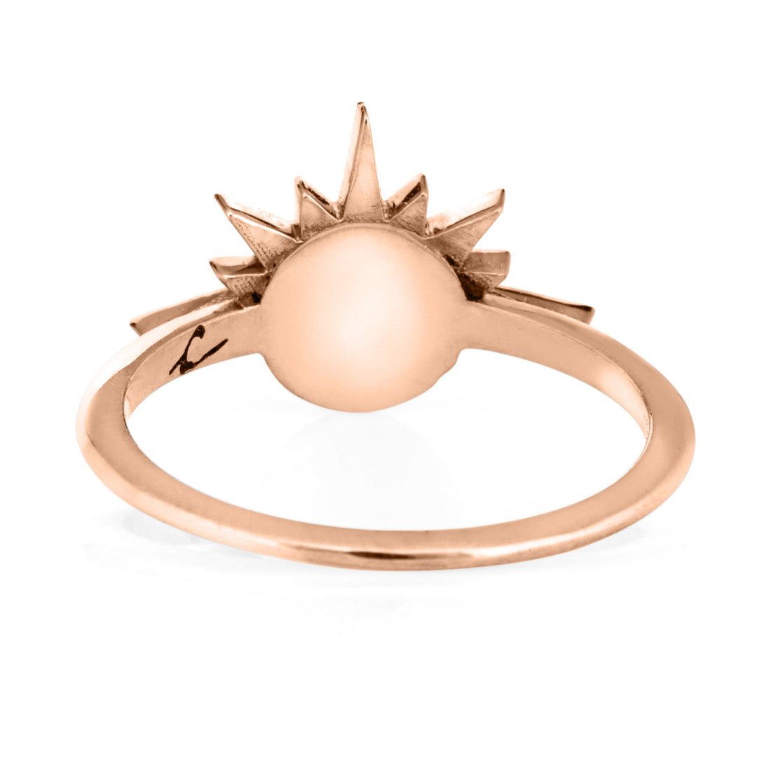 This photo shows close by me jewelry's 14K Rose Gold Sunrise Ring with cremains from the back