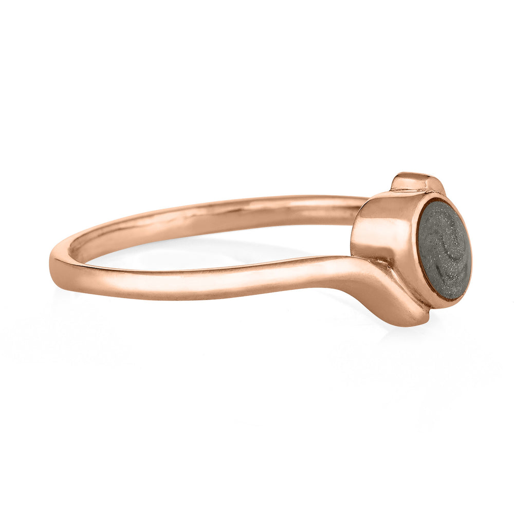 This photo shows the Tilted Oval Ashes Ring designed by close by me jewelry in 14K Rose Gold from the side