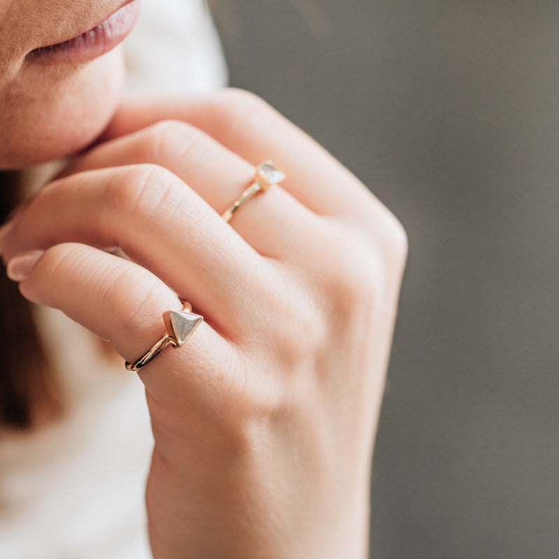 This photo shows the 14K Rose Gold Triangle Stacking Cremains Ring, designed by close by me jewelry, on a model&
