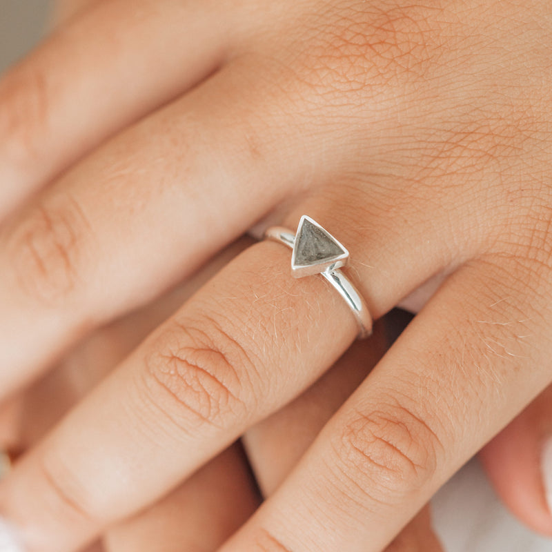 Pictured here is a close up of the Triangle Stacking Ring with cremated remains designed by close by me jewelry in Sterling Silver on a model&