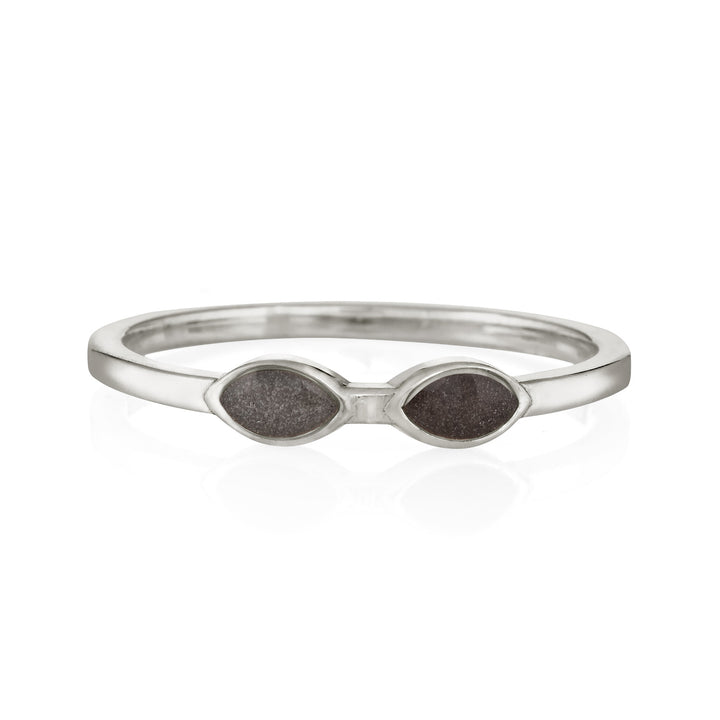 Pictured here is close by me jewelry's Sterling Silver Two Setting Cremation Ring from the front to show its light and dark gray ashes setting