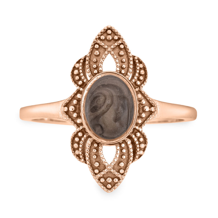 Pictured here is a close-up front view of Close By Me Jewelry's vintage-style WWII Cremation Ring in 14K Rose Gold, featuring a large oval bezel containing solidified ashes.