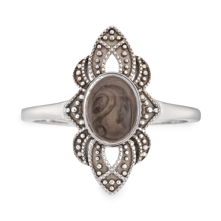 Pictured here is a close-up front view of Close By Me Jewelry's vintage-style WWII Cremation Ring in Sterling Silver, featuring a large oval bezel containing solidified ashes.
