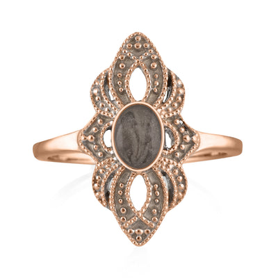 Pictured here is a close-up front view of Close By Me Jewelry's vintage-style World War II Cremation Ring in 14K Rose Gold set against a solid white background. This version of the ring features a smaller oval bezel containing solidified cremated remains. The ashes setting in this picture is dark gray in color and has a subtle swirl design.